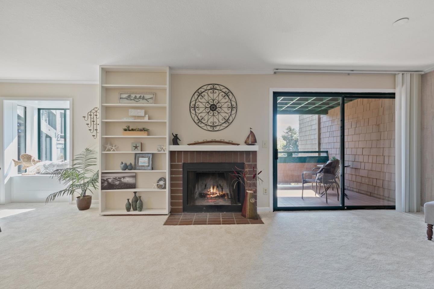 321 Broadway, Unit C2 Santa Cruz, CA 95060 - Photo 2 of 46 a living room with furniture and a fireplace