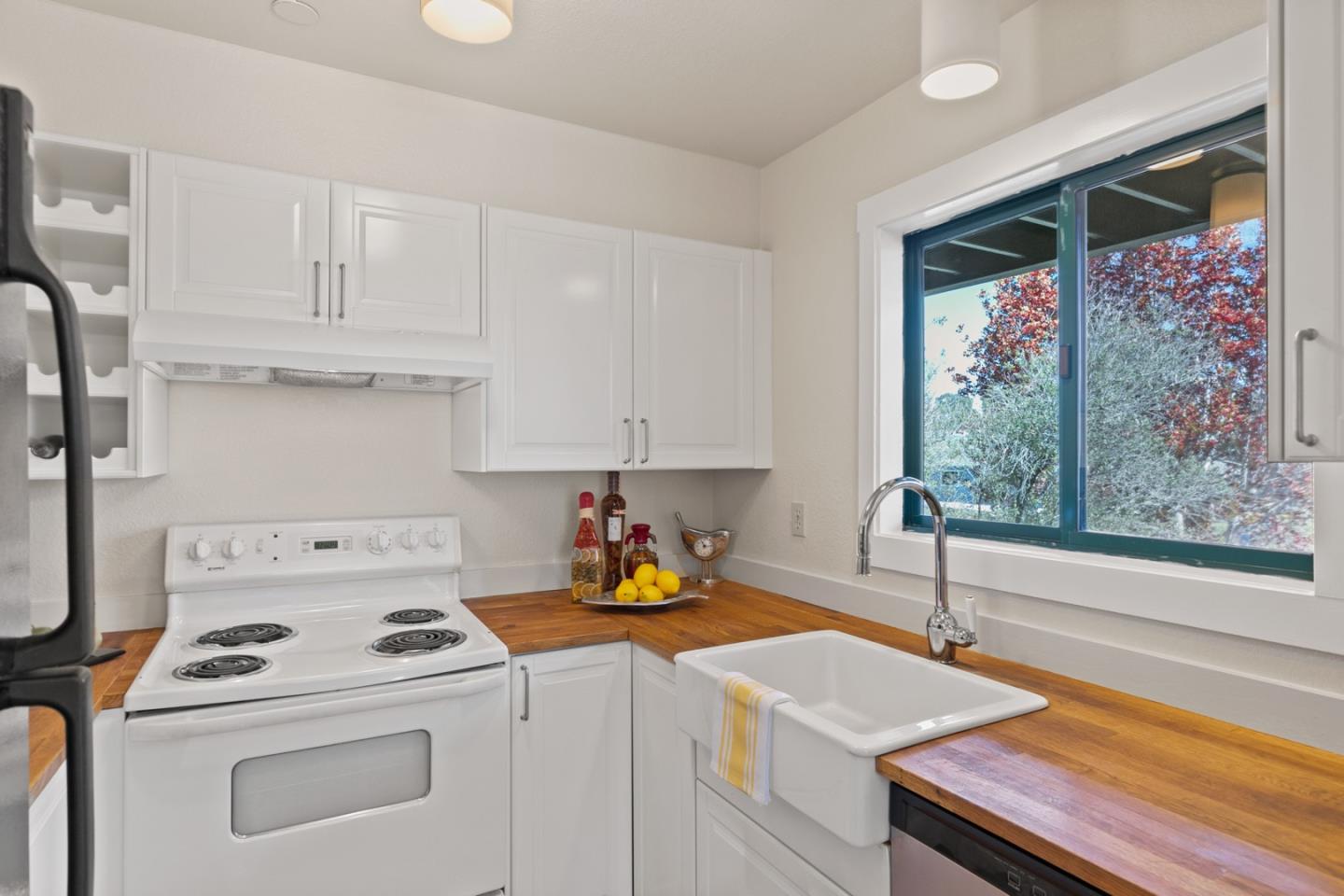 321 Broadway, Unit C2 Santa Cruz, CA 95060 - Photo 10 of 46 a kitchen with a stove a sink and a refrigerator