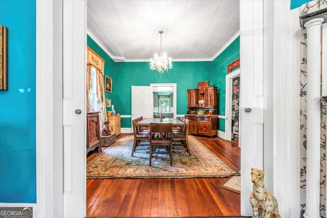 a view of a dining room with furniture window and wooden floor