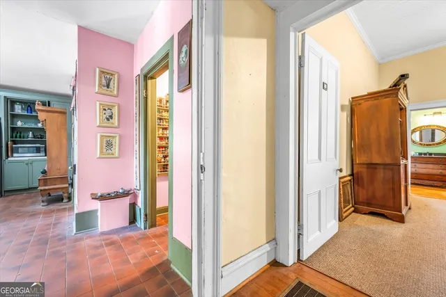 a view of entryway with wooden floor and stairs