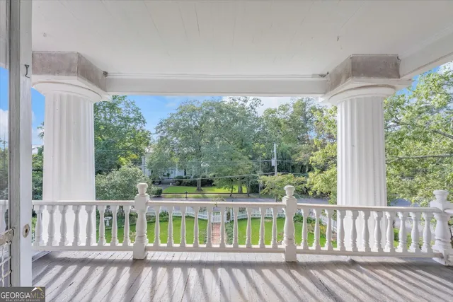 an aerial view of a house with outdoor space