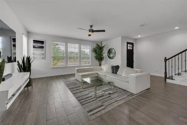 a living room with furniture and a large window
