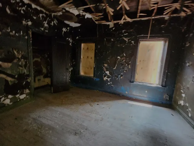 a bathroom with a granite countertop sink a toilet and mirror
