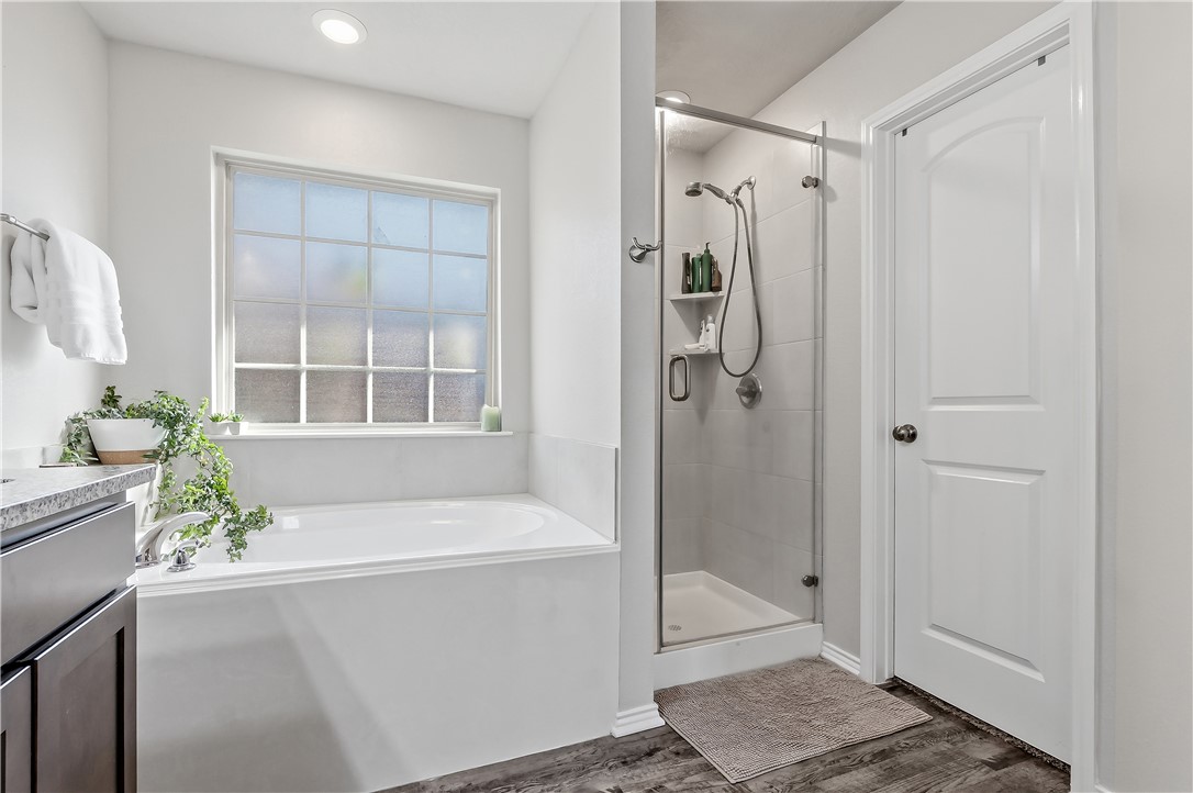 2721 Porter's Way Bryan, TX 77803 - Photo 15 of 17 Primary bath with garden tub, separate shower, granite countertop & toilet closet