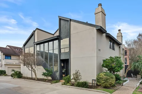 a kitchen with cabinets and window
