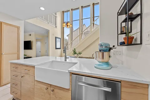 a kitchen with stainless steel appliances a refrigerator stove microwave and cabinets