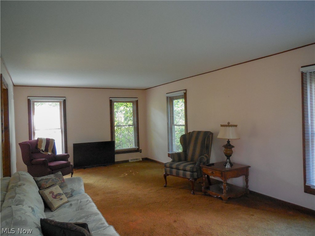 94 Hurd Road Aurora, OH 44202 - Photo 2 of 12 Upon entering the home the large living room is directly to your right and also has a doorway into the kitchen.