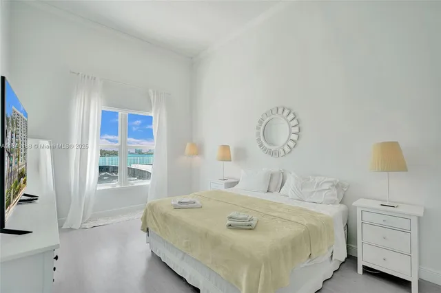 a bedroom with a bed and window