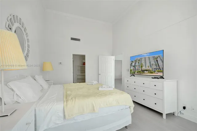 a bedroom with a bed and dresser