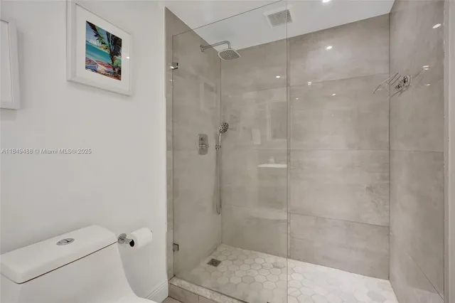 a bedroom with a bed and a lamp