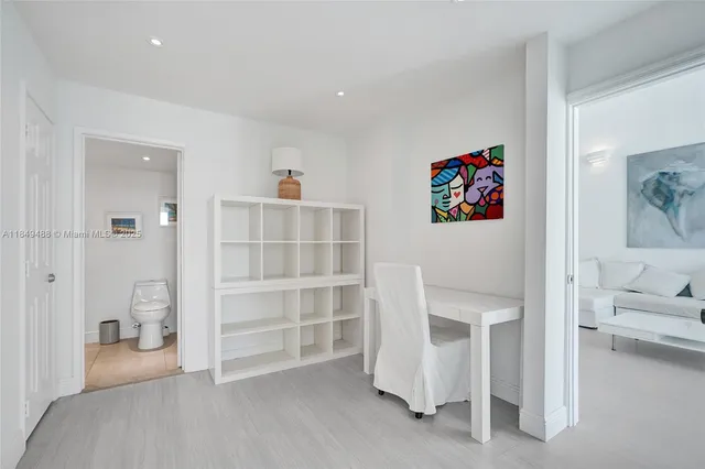 a view of an empty room with a white cabinet