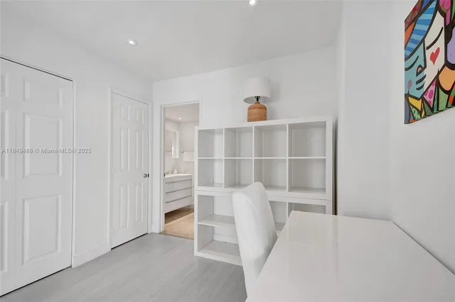 a view of a lake with couches chairs