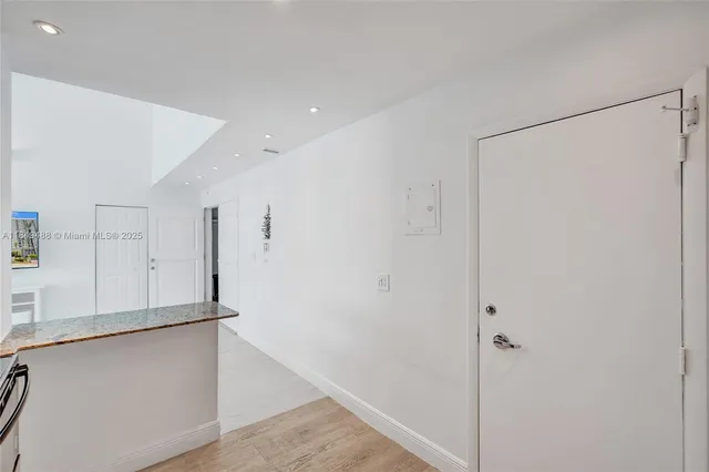 a kitchen with cabinets appliances and a sink