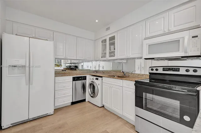 a view of a room that has a window and a table in it