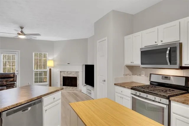 a kitchen with a stove and a microwave