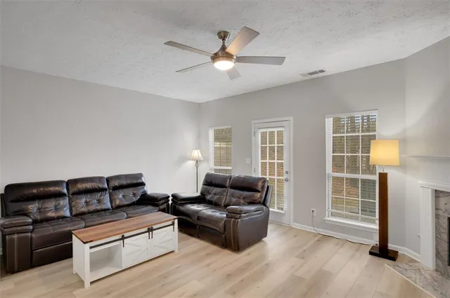 a living room with furniture and a window