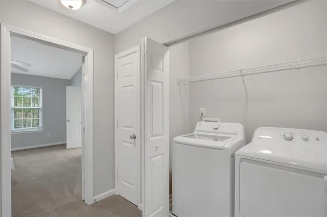 a utility room with dryer and washer