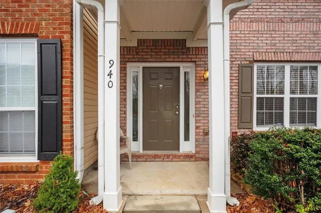 a front view of a house with a glass windows