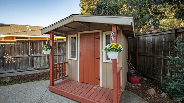 a view of a chairs and table in the patio