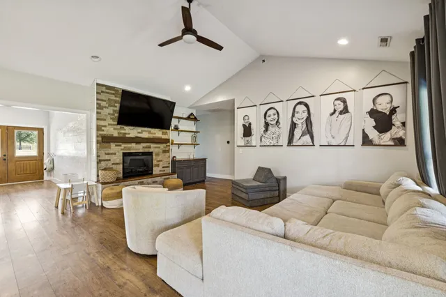 a living room with furniture and a large window