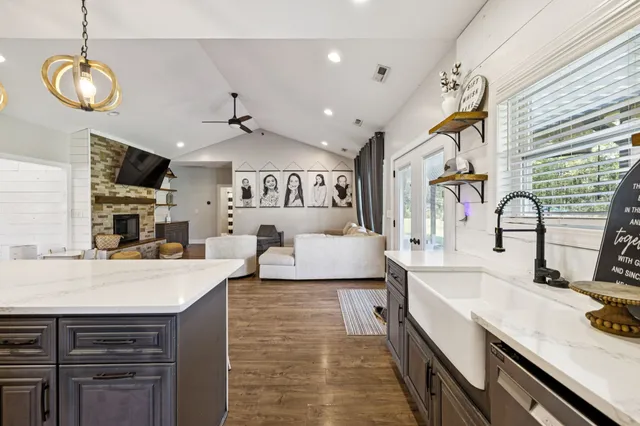a living room with furniture and a fireplace