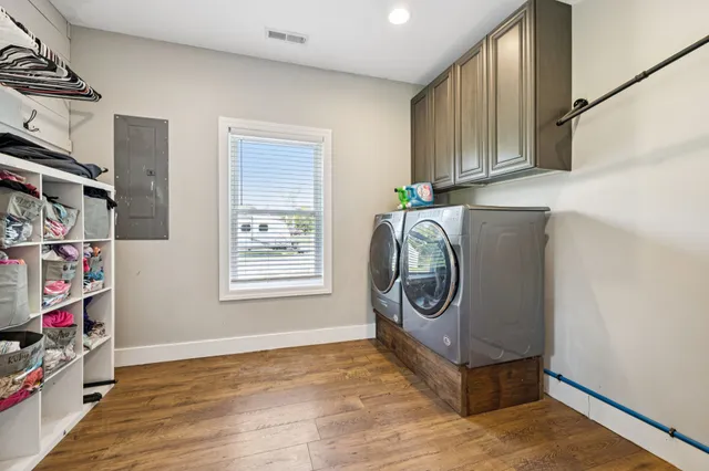 a bedroom with 2 bed and a window