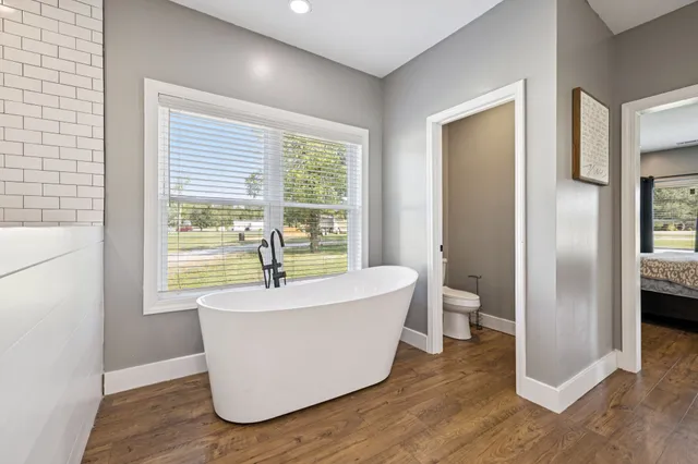 a bed room with a bed and a window