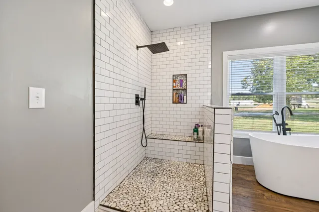 a view of a porch with furniture and garden