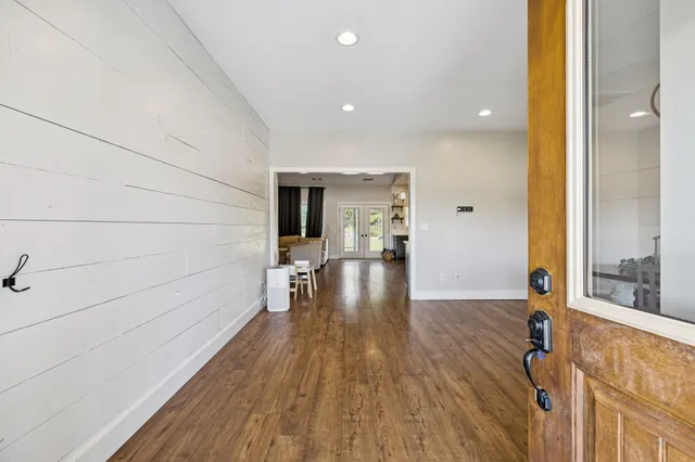 a view of a dining room with furniture wooden floor and a rug