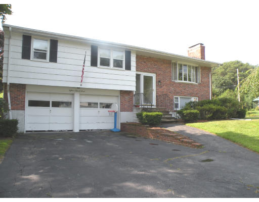 18 Edward Street Canton, MA 02021 - Photo 1 of 1 a front view of a house with a yard and garage