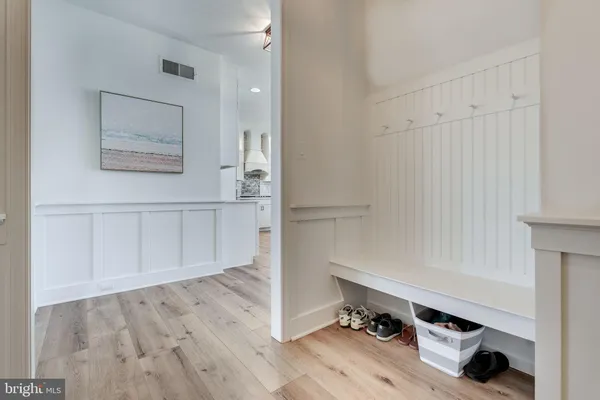 a view of an empty room and wooden floor