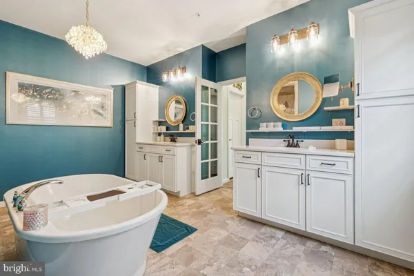 a bathroom with a sink a mirror and a toilet