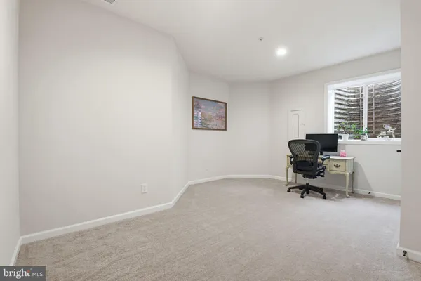 a workspace with furniture and a window
