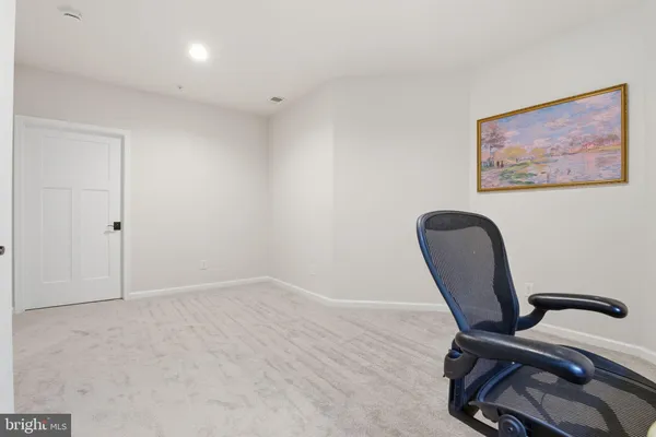a view of workspace with lounge chair