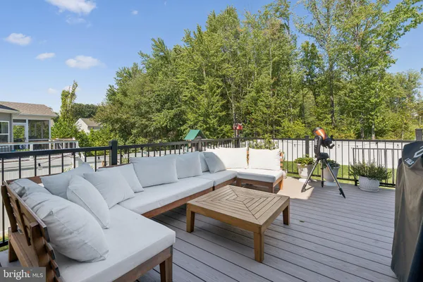 a view of a deck with furniture