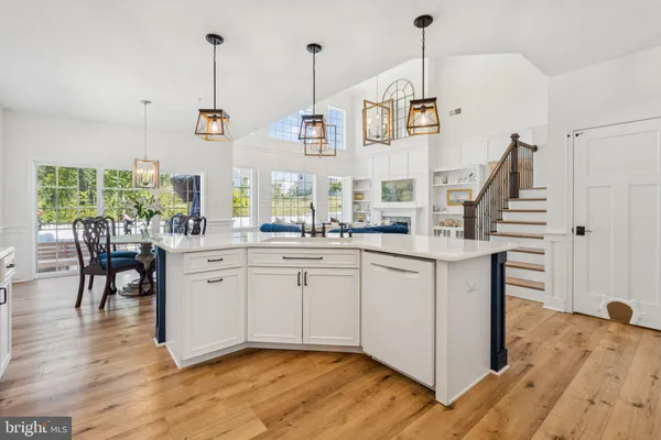 a view of kitchen with furniture and wooden floor