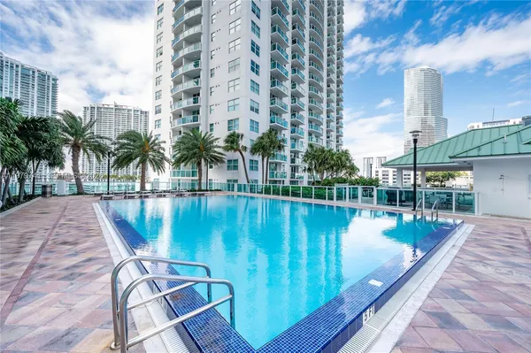 a view of a swimming pool with a lake view