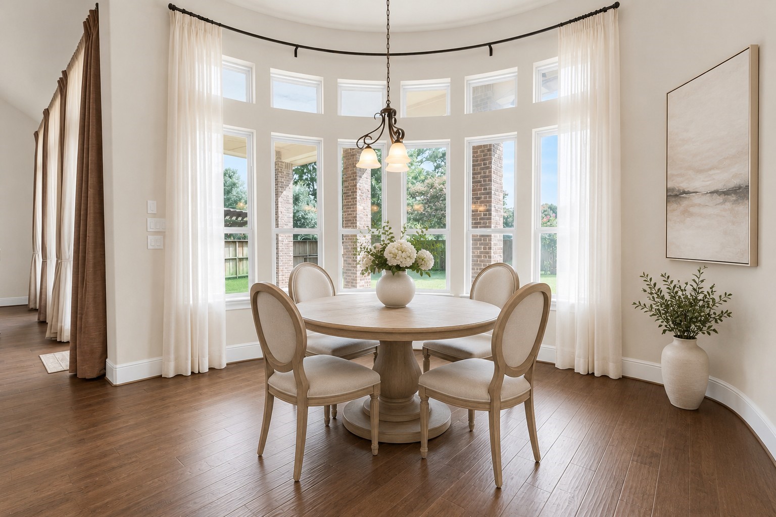 4022 Sabine Valley Trail Spring, TX 77386 - Photo 13 of 46 This photo showcases a bright, elegant breakfast area with large bay windows. Virtually staged to show the room’s potential.