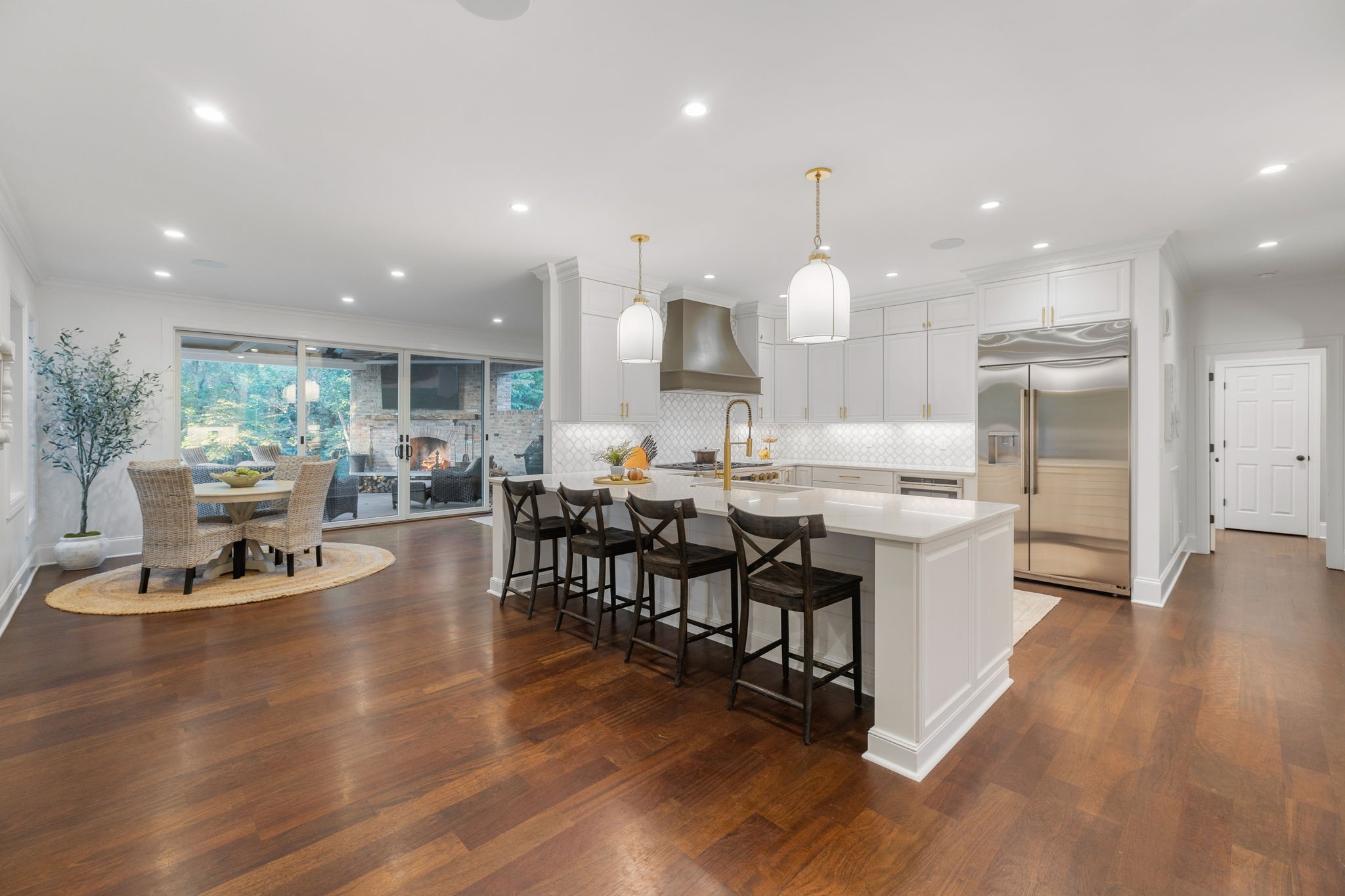 4420 Shores Road Murfreesboro, TN 37128 - Photo 16 of 89 a kitchen with stainless steel appliances kitchen island granite countertop a stove a sink a oven and a dining table with wooden floor