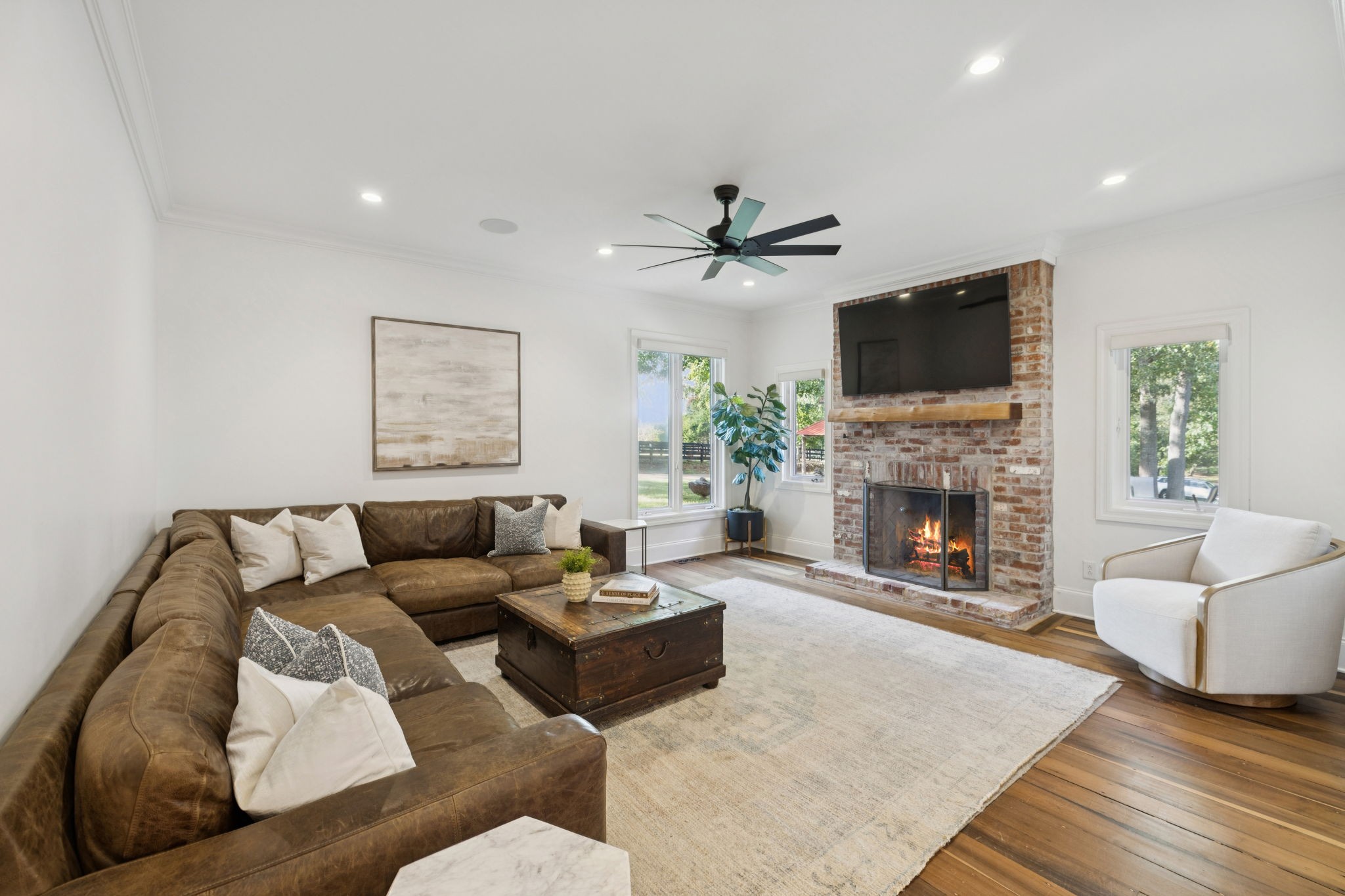 4420 Shores Road Murfreesboro, TN 37128 - Photo 17 of 89 a living room with furniture a fireplace and a flat screen tv