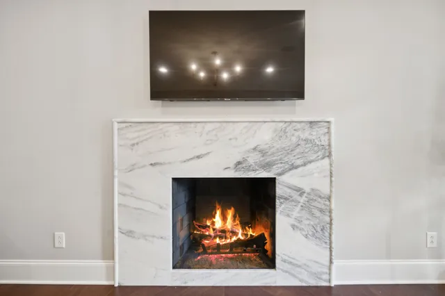 a living room with furniture pool table and flat screen tv