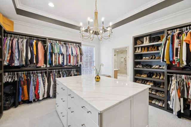 a view of a house with swimming pool and sitting area