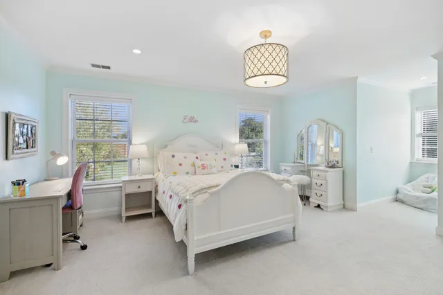 an aerial view of a house with a garden and swimming pool
