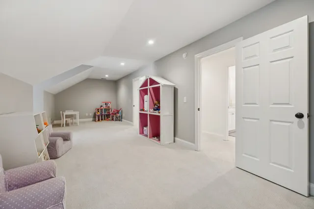 a view of a swimming pool with a big yard and large trees