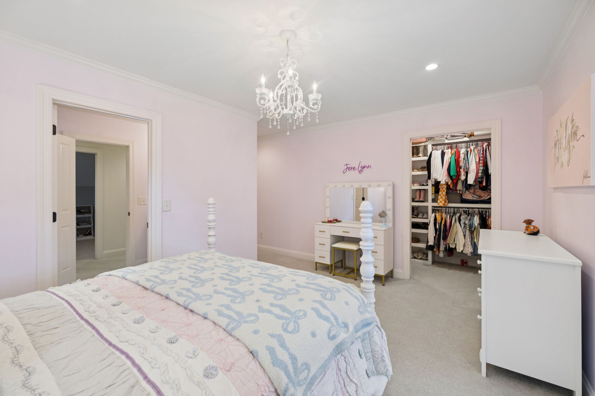 4420 Shores Road Murfreesboro, TN 37128 - Photo 44 of 89 a bedroom with a large bed and a chandelier