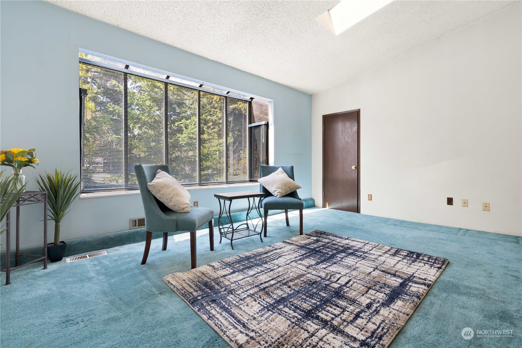11801 Silver Way Everett, WA 98208 - Photo 11 of 32 a living room with a rug couches and a coffee table