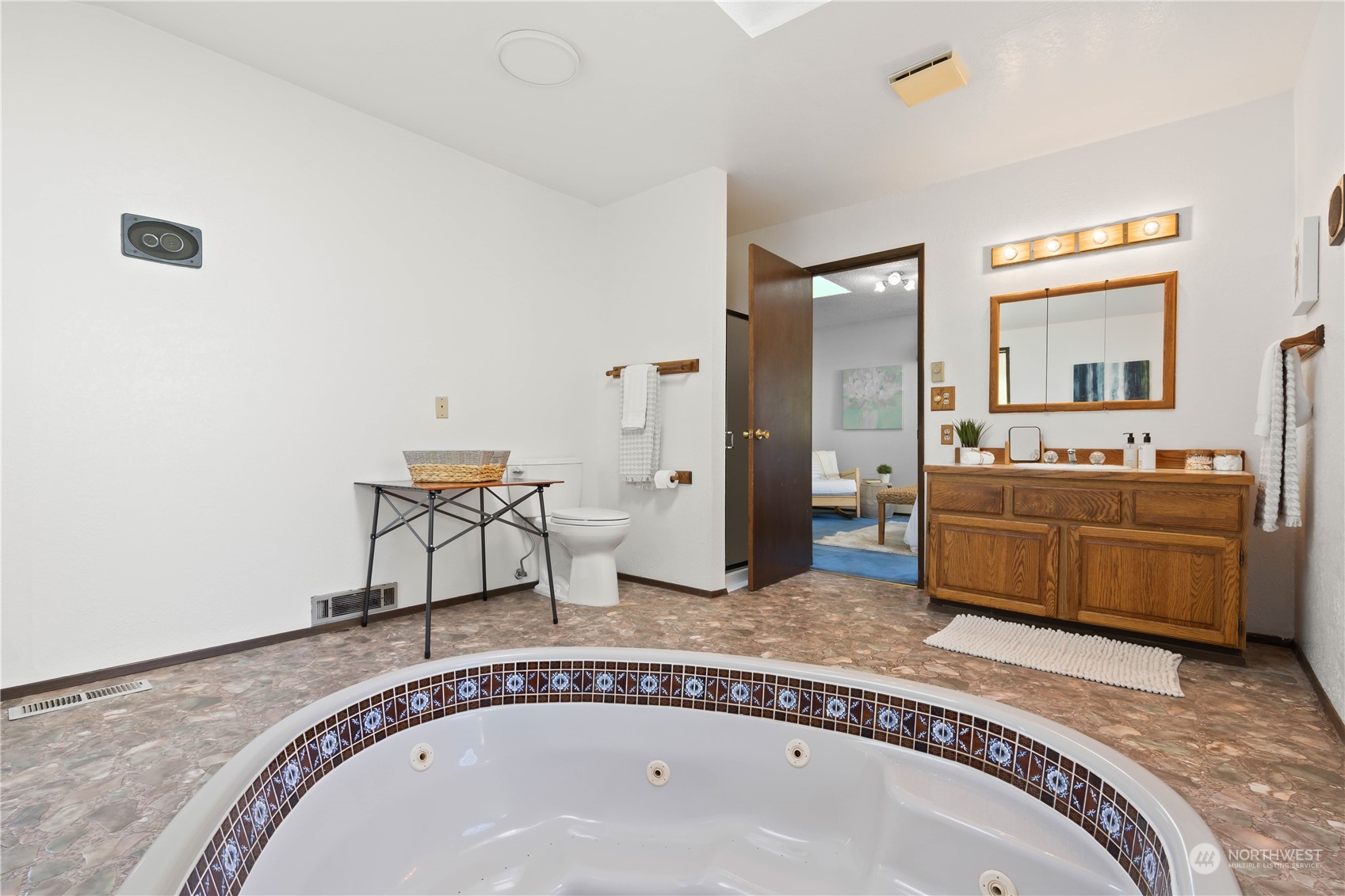 11801 Silver Way Everett, WA 98208 - Photo 13 of 32 a spacious bathroom with a granite countertop sink and a mirror