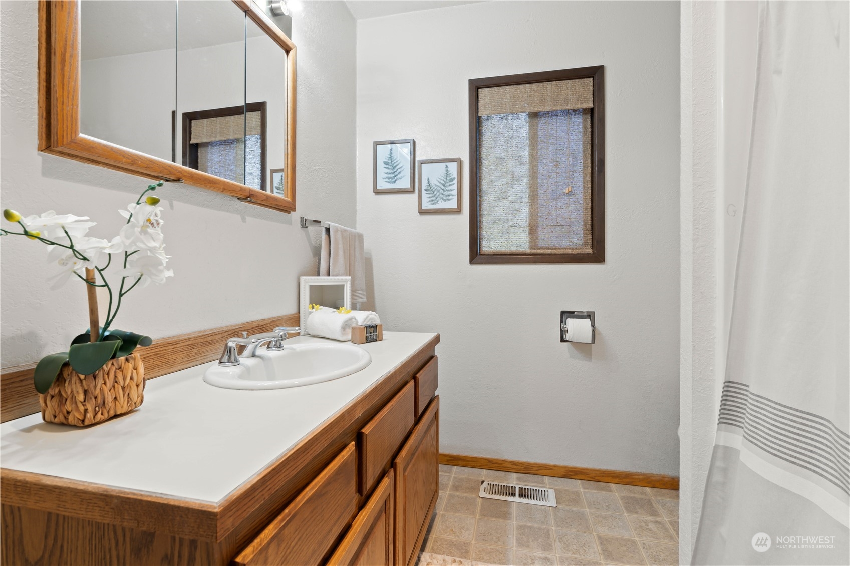 11801 Silver Way Everett, WA 98208 - Photo 16 of 32 a bathroom with a sink and a mirror
