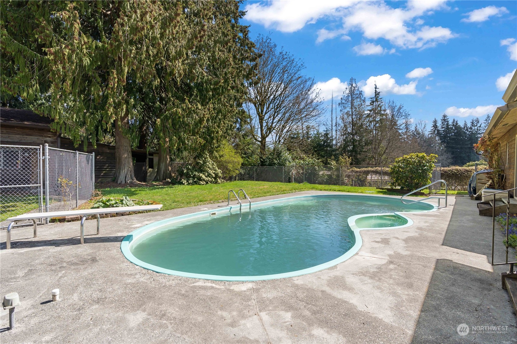 11801 Silver Way Everett, WA 98208 - Photo 19 of 32 a view of a swimming pool with sitting area