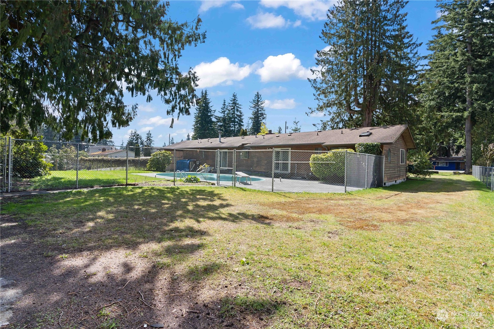 11801 Silver Way Everett, WA 98208 - Photo 29 of 32 a view of a house with swimming pool and a yard